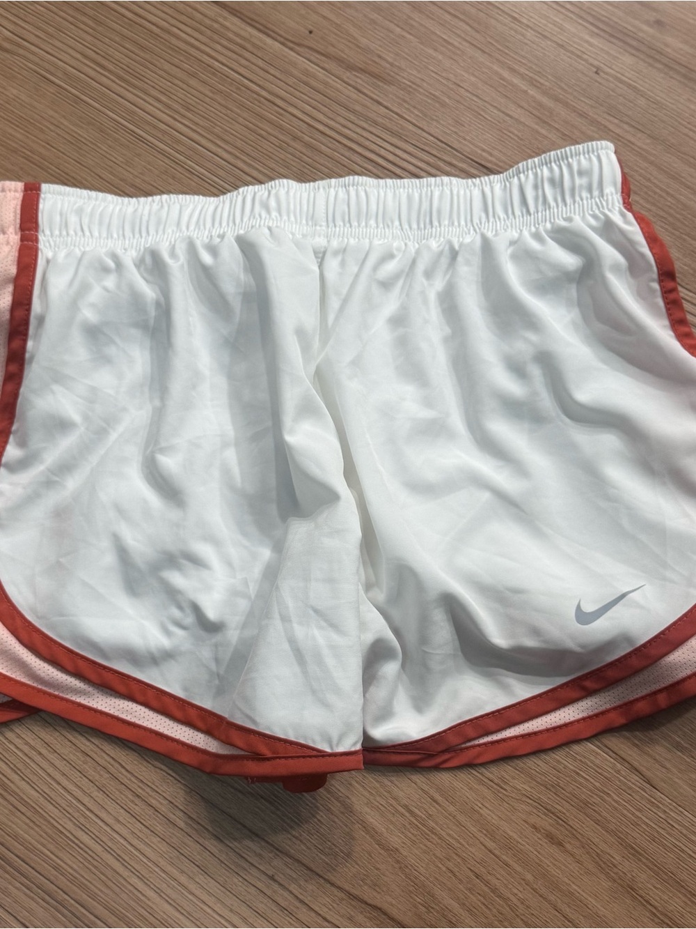 Nike Women's White Athletic Shorts with Rust Accent